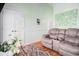 Comfortable living room with a plush reclining sofa, decorative floral arrangements, and cozy ambiance at 6001-R11 S Kings Hwy., Myrtle Beach, SC 29575