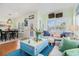 Inviting living room seamlessly blending into the dining area, with stylish furniture and beach-themed decor at 6001-R11 S Kings Hwy., Myrtle Beach, SC 29575