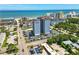 Stunning overhead view of a condo building, parking, tennis court, and picturesque coastal surroundings at 601 Mitchell Dr. # 607, Myrtle Beach, SC 29577