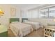 Cozy bedroom featuring twin beds and a comfortable seating area at 601 Mitchell Dr. # 607, Myrtle Beach, SC 29577