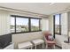 Bright room features large windows, with city views and a cozy chair with decorative pillow at 601 Mitchell Dr. # 607, Myrtle Beach, SC 29577