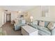 Bright living room with comfortable seating, dining area, and a glimpse into the kitchen at 601 Mitchell Dr. # 607, Myrtle Beach, SC 29577