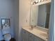 Well-lit bathroom featuring a double sink vanity, large mirror, and a separate shower at 62 4 Rye Grass Ln. # 4, Pawleys Island, SC 29585