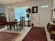 Cozy dining room with a chandelier, natural light, and carpeted flooring at 62 4 Rye Grass Ln. # 4, Pawleys Island, SC 29585