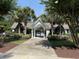Community entrance framed by palm trees, lush landscaping, and a gated entrance at 62 4 Rye Grass Ln. # 4, Pawleys Island, SC 29585