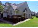 Charming home with beige siding, brick accents, manicured landscaping, and a well-maintained lawn at 62 4 Rye Grass Ln. # 4, Pawleys Island, SC 29585