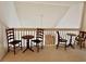 Cozy loft featuring wood chairs and tables, offering a relaxing retreat at 62 4 Rye Grass Ln. # 4, Pawleys Island, SC 29585