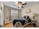 Cozy bedroom with a ceiling fan, nightstands, and black and white bedding at 6210 Blynn Dr., Myrtle Beach, SC 29572