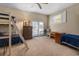 Comfortable bedroom with bunk beds, carpet, and a ceiling fan at 6210 Blynn Dr., Myrtle Beach, SC 29572