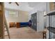 Bedroom with a bed, ceiling fan, and door leading to the kitchen at 6210 Blynn Dr., Myrtle Beach, SC 29572