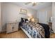 Comfortable bedroom with a ceiling fan, laminate floor, and simple decor at 6210 Blynn Dr., Myrtle Beach, SC 29572
