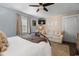 This bedroom features a neutral palette, love seat and a wrought iron bed frame at 6210 Blynn Dr., Myrtle Beach, SC 29572