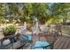 Outdoor deck space with seating area and view of the landscaped backyard at 6210 Blynn Dr., Myrtle Beach, SC 29572