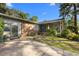 Close up of charming home featuring a brick exterior and welcoming front porch at 6210 Blynn Dr., Myrtle Beach, SC 29572
