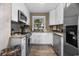 Bright kitchen featuring stainless steel appliances, white cabinets, and granite countertops at 6210 Blynn Dr., Myrtle Beach, SC 29572
