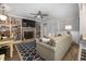 Inviting living room showcasing built-in bookshelves, a brick fireplace, and comfortable seating at 6210 Blynn Dr., Myrtle Beach, SC 29572