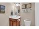 Bathroom featuring a vanity with dark wood cabinets and beige walls with framed art at 6253 Catalina Dr. # 1824, North Myrtle Beach, SC 29582