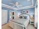 Bedroom with blue walls, white furniture, coastal decor, and en-suite bathroom at 6253 Catalina Dr. # 1824, North Myrtle Beach, SC 29582