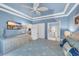 Bedroom with blue walls, white dresser, TV, ceiling fan, and en-suite bathroom access at 6253 Catalina Dr. # 1824, North Myrtle Beach, SC 29582