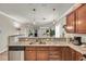 Kitchen with granite countertops and stainless steel appliances overlooking the living areas at 6253 Catalina Dr. # 1824, North Myrtle Beach, SC 29582