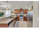 Kitchen featuring stainless steel appliances, granite counters, and dark wood cabinets at 6253 Catalina Dr. # 1824, North Myrtle Beach, SC 29582