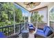 Screened-in porch features comfortable seating, ceiling fan and scenic views of the surrounding nature at 6253 Catalina Dr. # 1824, North Myrtle Beach, SC 29582