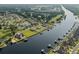 Aerial view of waterfront community, showing homes with docks and water access to a waterway and golf course at 668 Barona Dr., Myrtle Beach, SC 29579