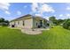 Well-maintained backyard with lush green grass, manicured landscaping, and a view of the home's exterior at 668 Barona Dr., Myrtle Beach, SC 29579