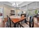 Formal dining room featuring wooden table, chairs, columns, and hardwood floors at 668 Barona Dr., Myrtle Beach, SC 29579
