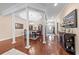 Formal dining room with elegant columns, tray ceiling, hardwood floors, and sophisticated furnishings at 668 Barona Dr., Myrtle Beach, SC 29579