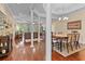 Open-concept living area with hardwood floors connecting the dining and living rooms at 668 Barona Dr., Myrtle Beach, SC 29579