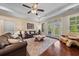 Comfortable living room with hardwood floors, ceiling fan, and bright natural light at 668 Barona Dr., Myrtle Beach, SC 29579