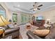 Inviting living room features hardwood floors, leather furniture, and a cozy fireplace at 668 Barona Dr., Myrtle Beach, SC 29579
