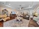 Spacious living room with leather furniture, fireplace, and large patterned rug at 668 Barona Dr., Myrtle Beach, SC 29579