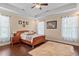 Inviting main bedroom showcasing tray ceiling and hardwood flooring at 668 Barona Dr., Myrtle Beach, SC 29579