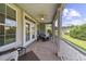 Relaxing screened patio with comfortable seating, ceiling fan, and views of the landscaped backyard at 668 Barona Dr., Myrtle Beach, SC 29579