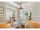 Dining room with hardwood floors, glass table, and wicker chairs at 670 2Nd Ave. N, North Myrtle Beach, SC 29582