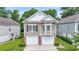 Charming home with a two-car garage and well-maintained lawn at 670 2Nd Ave. N, North Myrtle Beach, SC 29582