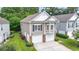 Traditional home showcasing a two-car garage and manicured landscaping at 670 2Nd Ave. N, North Myrtle Beach, SC 29582