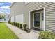Charming home exterior showcasing well-maintained landscaping, a tidy walkway, and a welcoming front entry at 670 2Nd Ave. N, North Myrtle Beach, SC 29582