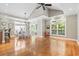 Spacious dining area with hardwood floors, a chandelier, and large windows at 670 2Nd Ave. N, North Myrtle Beach, SC 29582