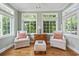 Charming sitting area with hardwood floors, natural light, and comfortable seating at 670 2Nd Ave. N, North Myrtle Beach, SC 29582