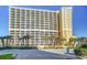 Beautiful multi-story condo building featuring multiple balconies and manicured landscaping at 6900 N Ocean Blvd. # 734, Myrtle Beach, SC 29572