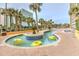 Enjoy the community lazy river with palm trees and beautiful brick patio at 6900 N Ocean Blvd. # 734, Myrtle Beach, SC 29572