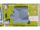 Overhead aerial view of a home with a well-manicured backyard and dark roof shingles at 708 Alexis Dr., Longs, SC 29568