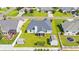 Aerial view of the home with a well-manicured backyard, including two sheds and a screened in porch at 708 Alexis Dr., Longs, SC 29568
