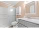 Clean bathroom features a vanity with gray cabinetry, white countertops, and a shower with glass doors at 708 Alexis Dr., Longs, SC 29568