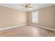Bedroom with wood-look floors, white trim, and a bright window at 708 Alexis Dr., Longs, SC 29568