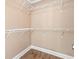 Spacious walk-in closet with shelving for organized storage and wood-look floors at 708 Alexis Dr., Longs, SC 29568
