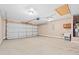 Spacious two car garage featuring concrete floors and a utility sink and storage at 708 Alexis Dr., Longs, SC 29568